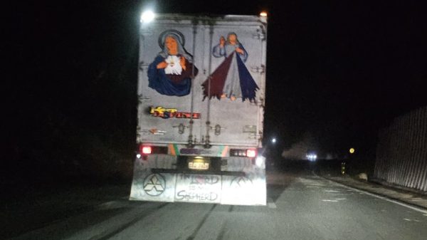 Alt text: A dark, uneven road in rural Mindanao—symbolic of the infrastructure barriers that hinder food distribution and agricultural access across the island.