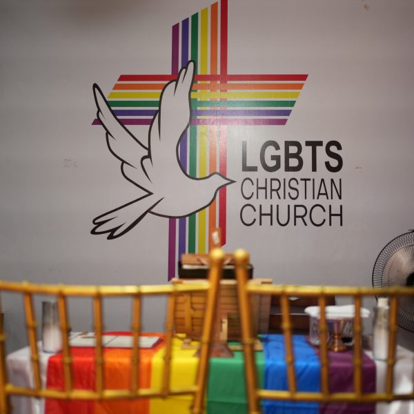 Same sex marriage Philippines altar at LGBTS Christian Church with rainbow linens symbolizing LGBTQIA+ inclusion and sacred union.