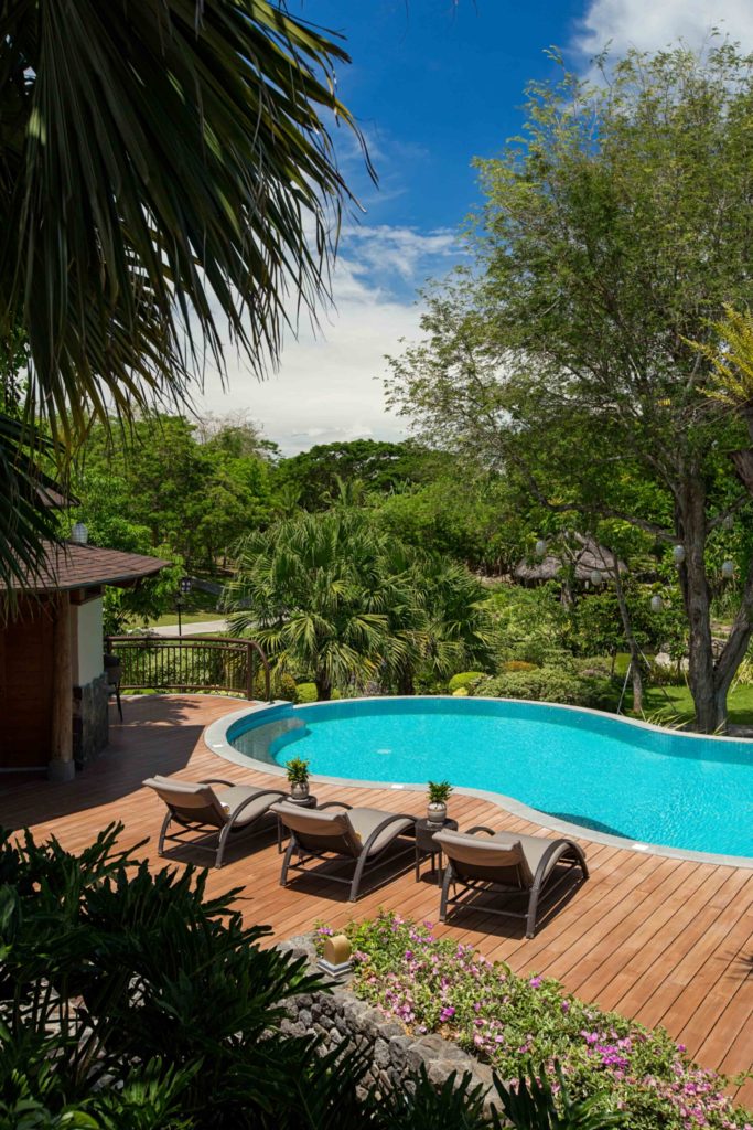 Courtyard at El Jardin de Zaida with Spanish-style columns and tropical greenery, a dreamy escape near Manila.