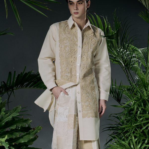 Designer Jor-el Espina holding fabric swatches of piña and hablon in his Iloilo studio.