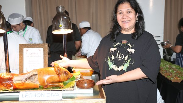 Alt text: Lechon Diva Dedet de la Fuente presenting her signature stuffed lechon at Hog Festival 2025 Philippines, highlighting Filipino culinary creativity and whole-hog cooking.
