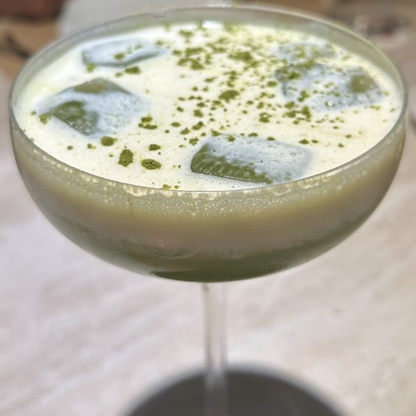 Close-up of matcha cocktail with coffee pairing served at Fable restaurant in BGC.