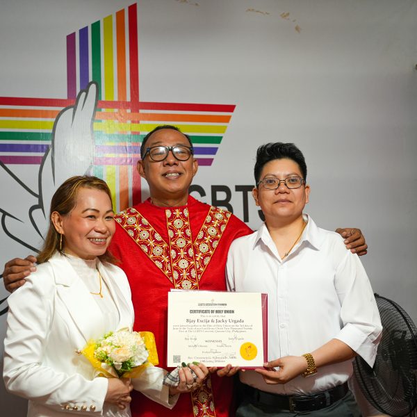 Same sex marriage Philippines couple Jacky and Bjay showing wedding certificates after symbolic ceremony, despite lack of legal government recognition.