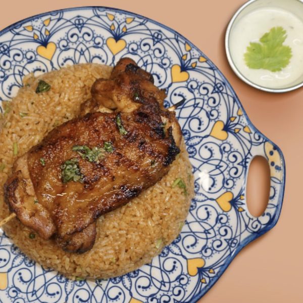 Chicken and pork skewers served with Mexican rice in Papi Oli Katipunan tacos’ rice meal lineup—meat-on-a-stick meets seasoned rice in a takeaway box.