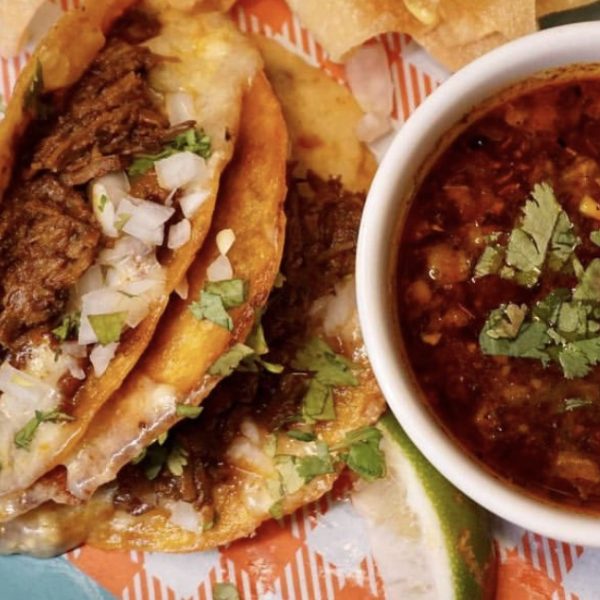 Signature beef birria from Papi Oli Katipunan tacos, slow-braised and folded into soft tortillas with consommé for dipping. 