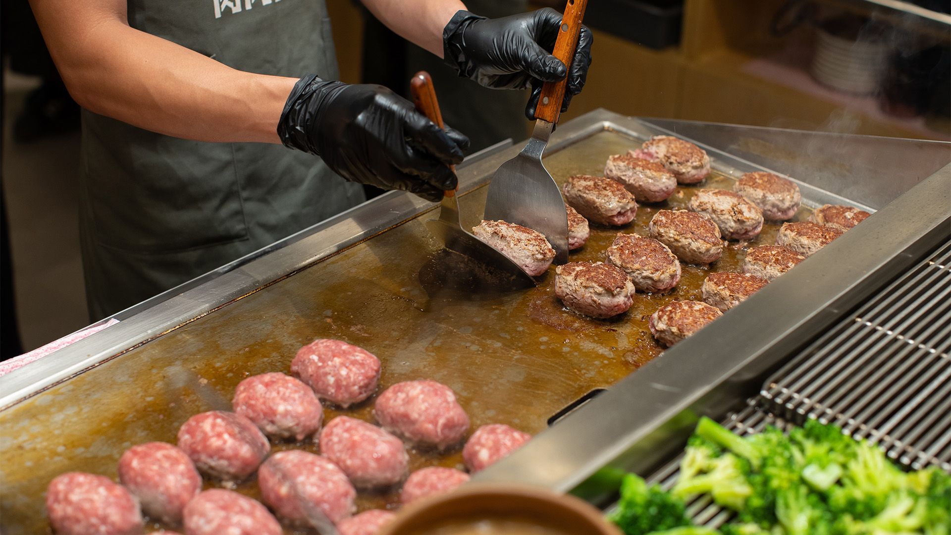 Japanese wagyu hamburg steak set with rice, soup, broccoli, pickled radish with bonito, and onsen egg.