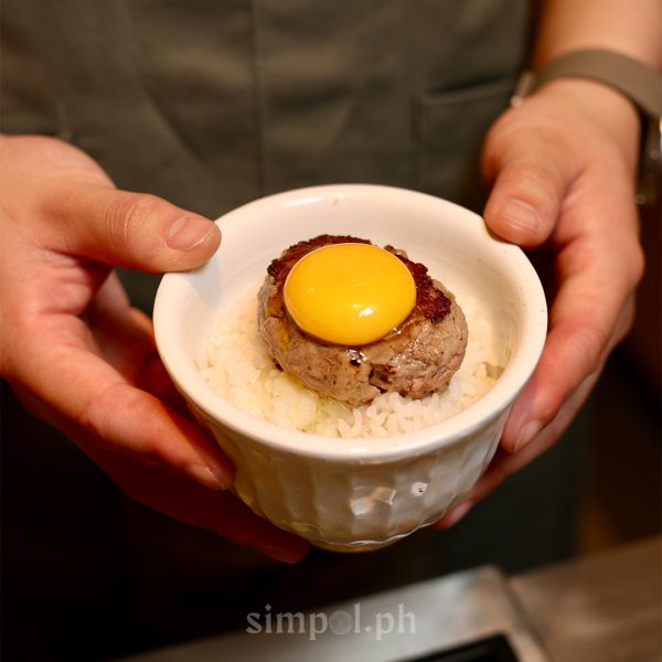 Rice bowl with wagyu patty and raw egg yolk served at Niku Niku Oh!! Kome, Japanese hamburger steak Manila.