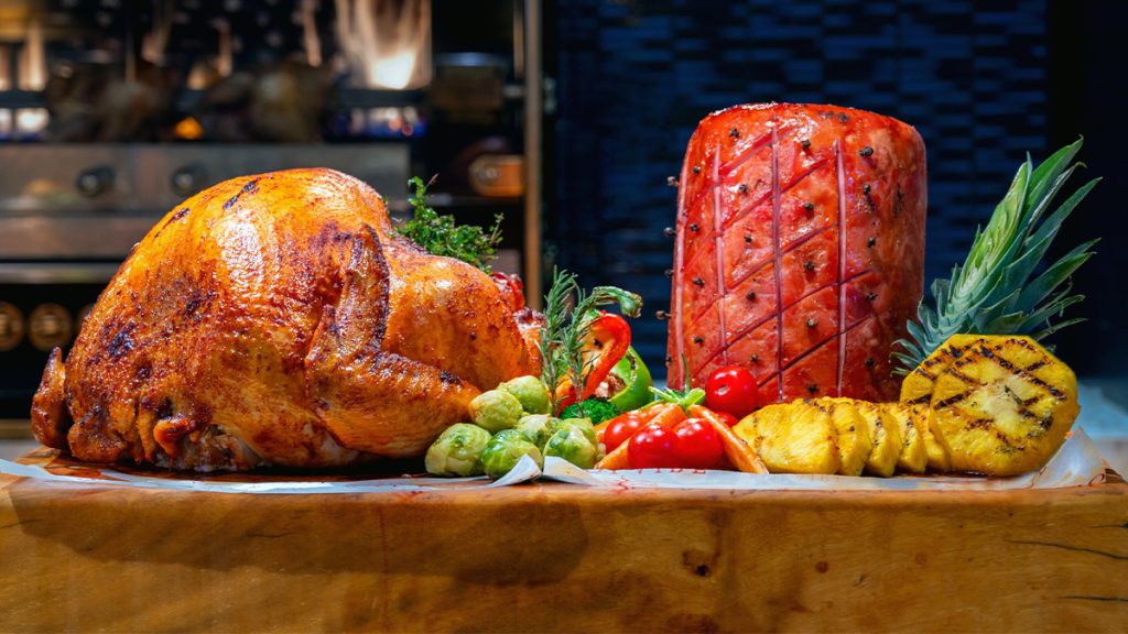 Carved with care, the latest herb-roasted turkey and honey-glazed ham take center stage at the Thanksgiving Solaire Resort North feast.